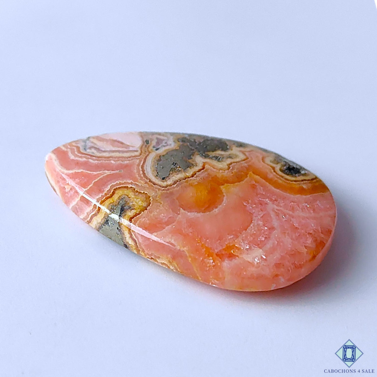 0-Rhodochrosite_With_Pyrite-C4sw23021-3-Pear-Pink-mm-Cabochons-Translucent-0