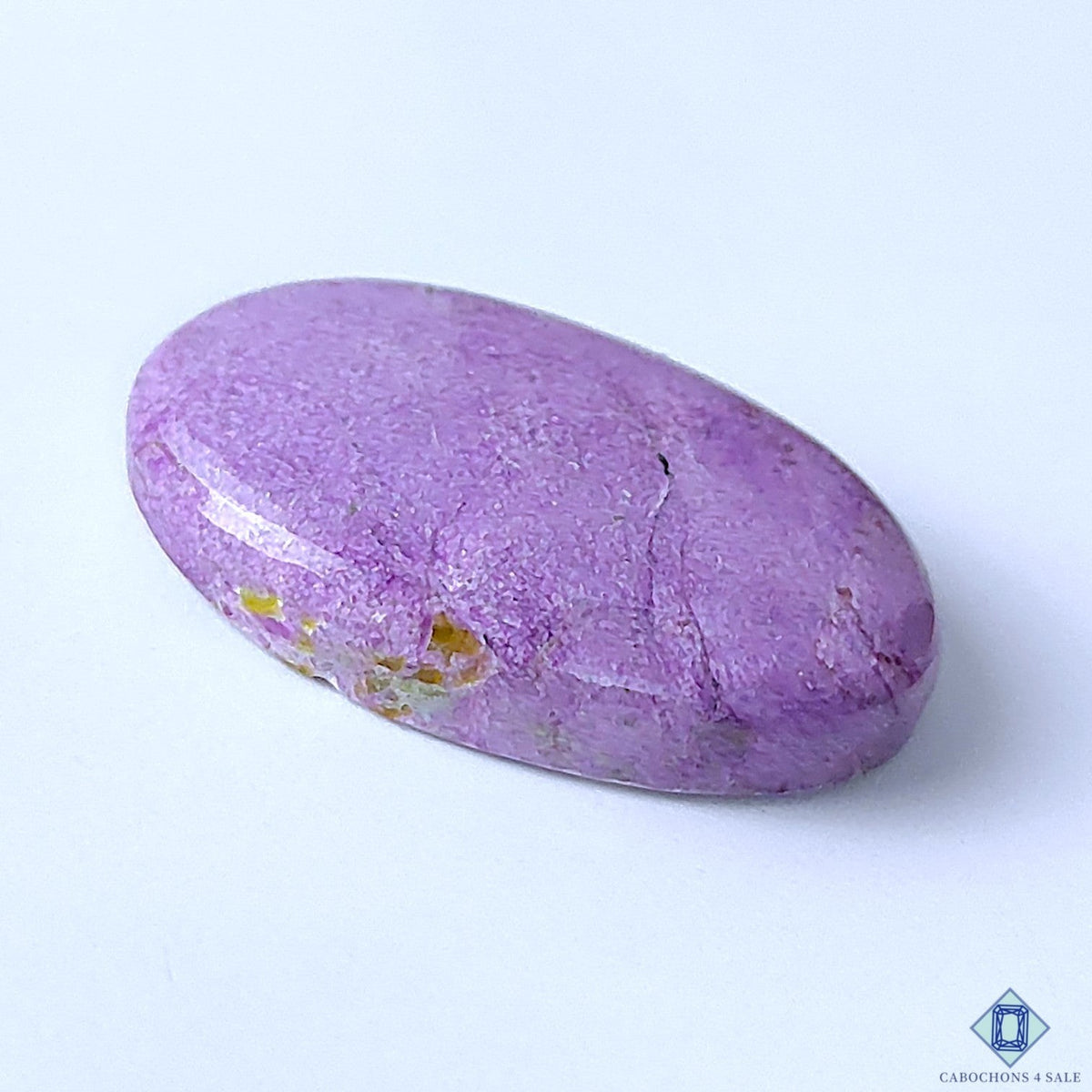 Cabochons4sale oval stichtite cabochon gemstone in a vibrant purple colour with opaque texture and smooth finish.