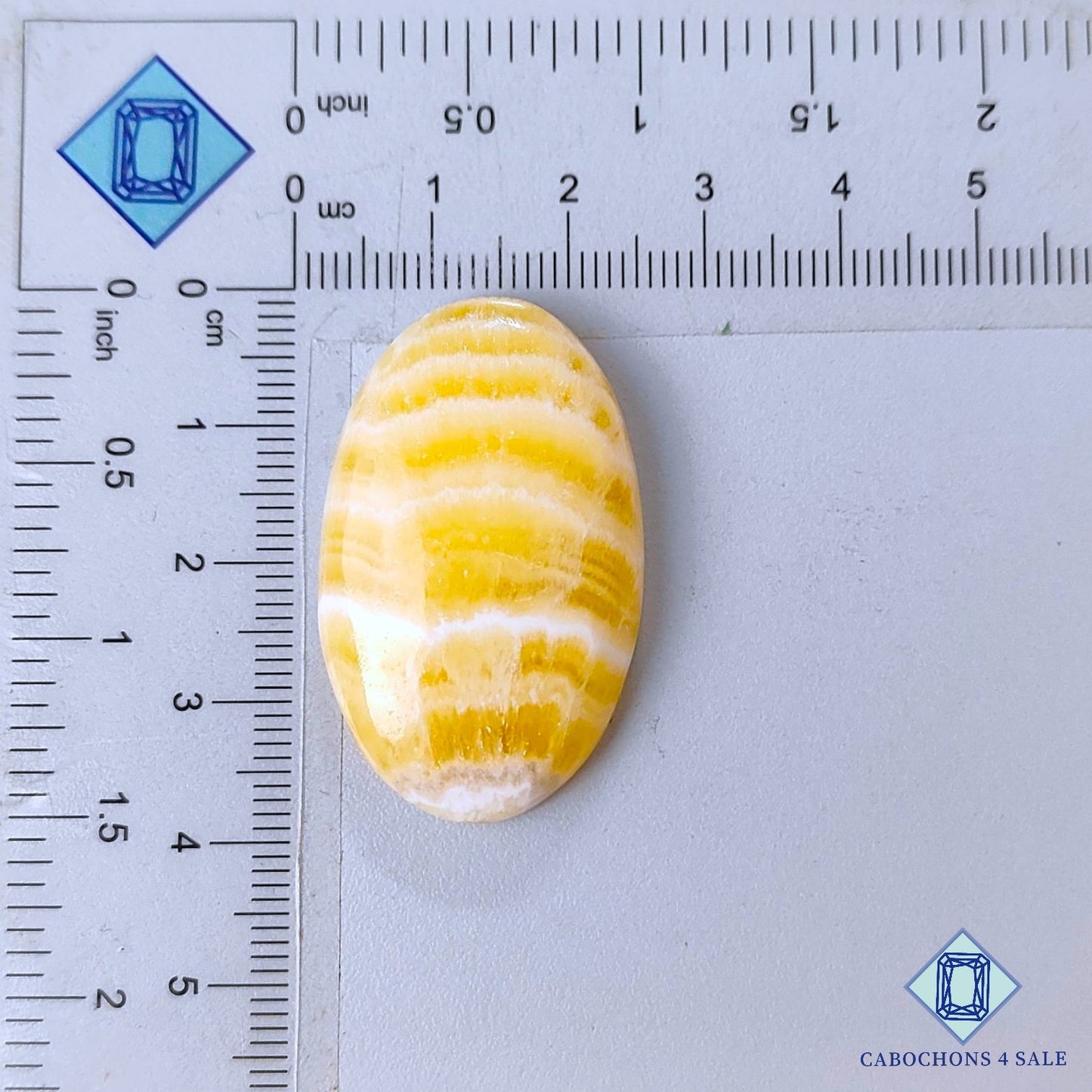 Cabujones ovalados de calcita amarilla natural de 37 x 23 x 7 mm, procedentes de México, disponibles para la venta.