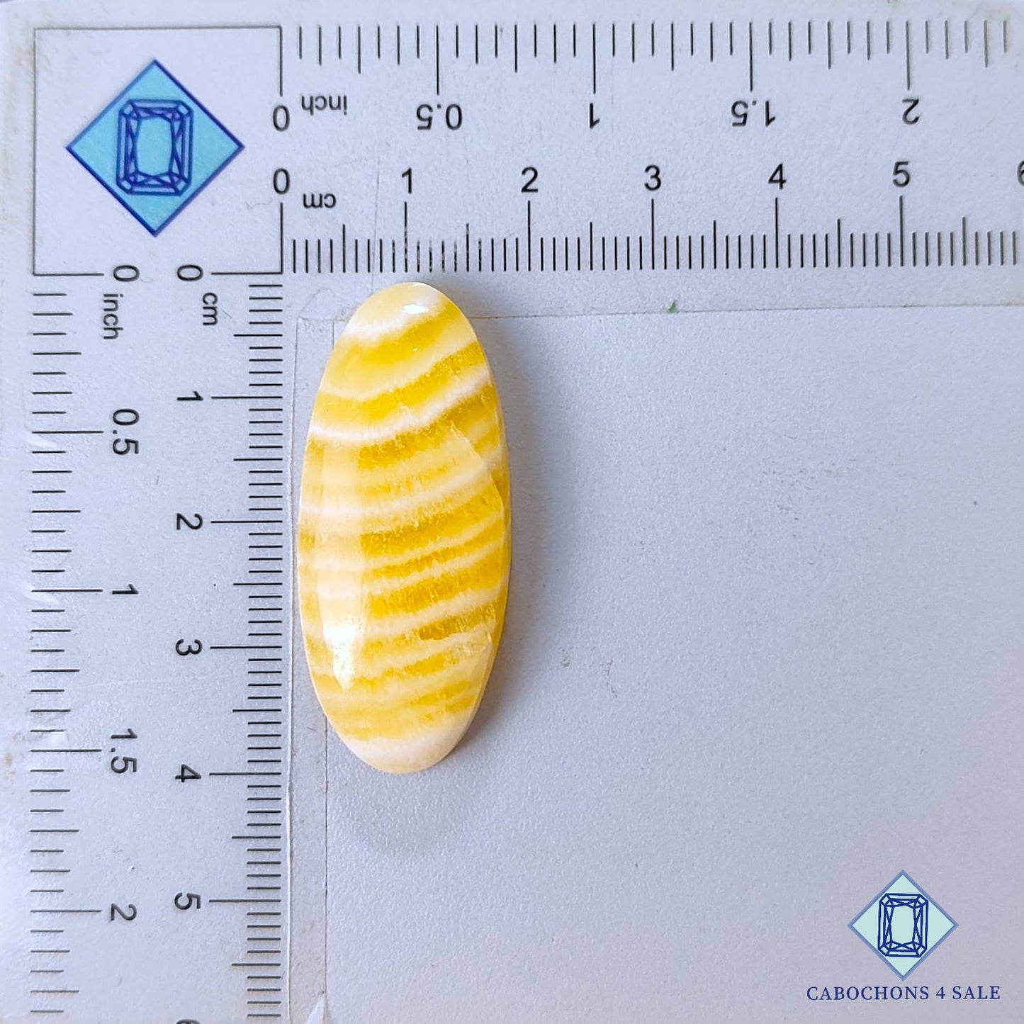 Cabujones ovalados de calcita amarilla natural de 39 x 16 x 7 mm, procedentes de México, disponibles para la venta.