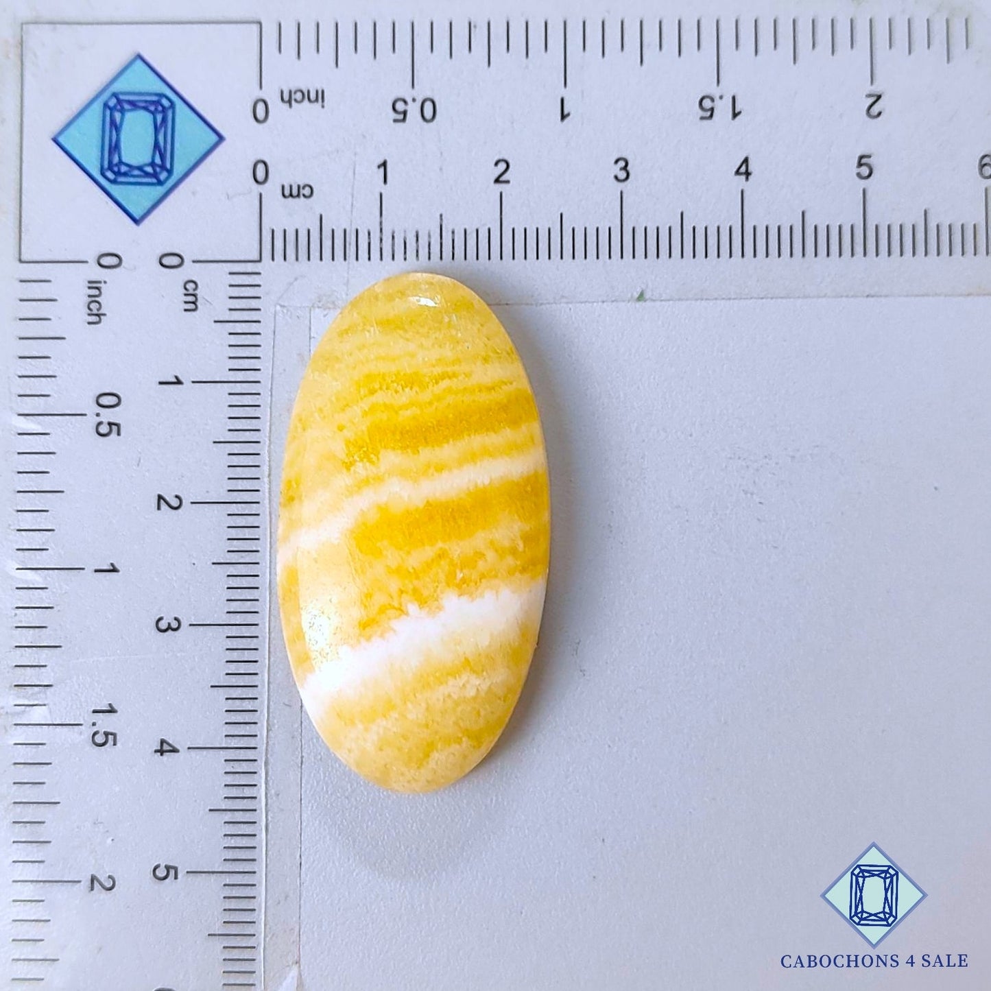 Cabujones ovalados de calcita amarilla natural de 42 x 22 x 8 mm, de México, disponibles para la venta.