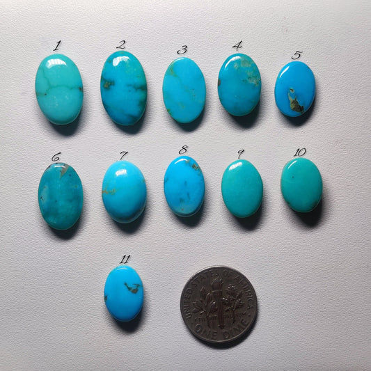 Cabochons4sale collection of eleven oval Arizona turquoise cabochons in blue and green shades with natural matrix.