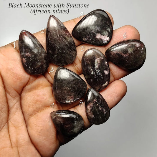 Cabochons4sale collection of polished black moonstone with sunstone cabochons showing natural shimmer and flashes