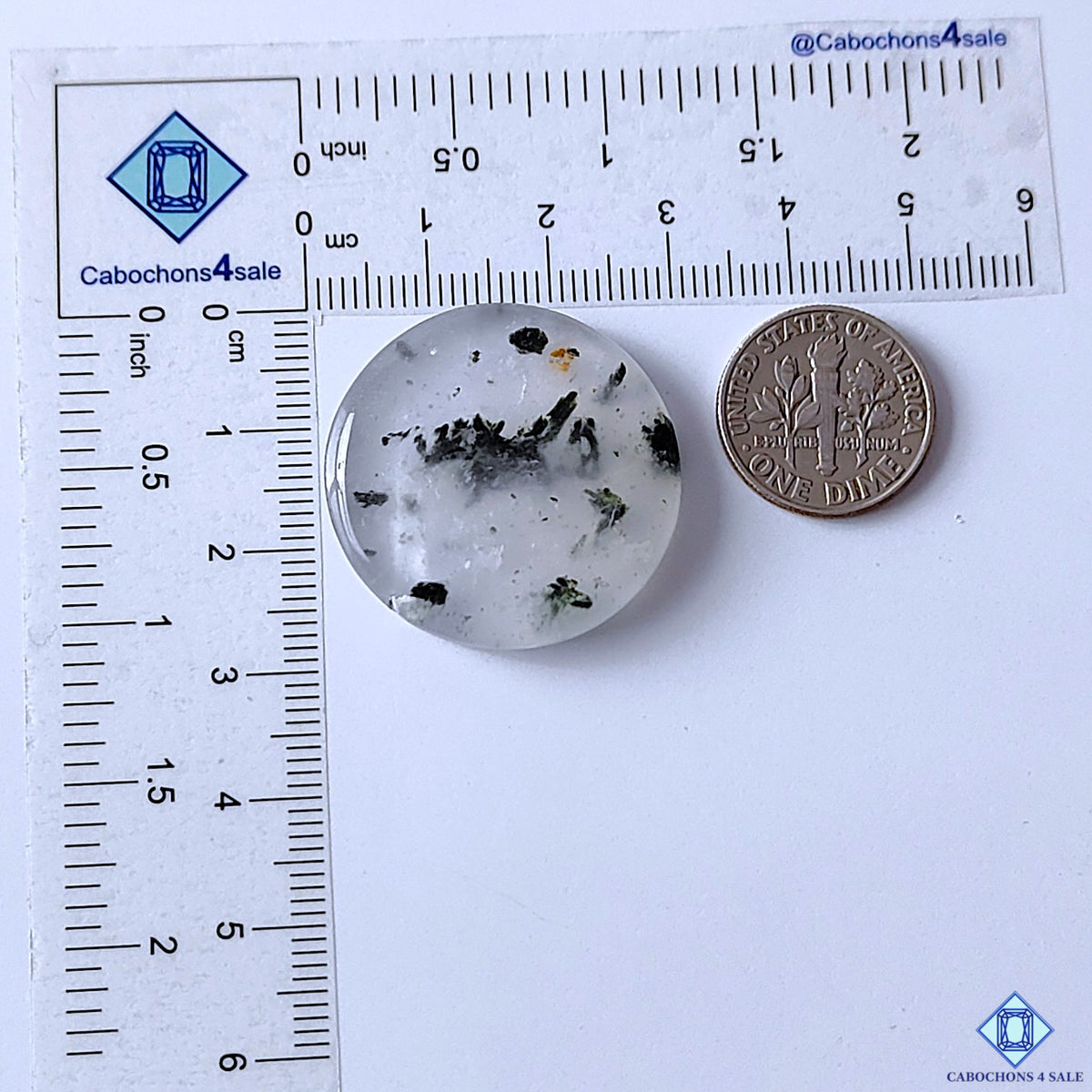 cabochons4sale, natural black dot quartz round cabochons featuring bold black spots across a milky white quartz base, unique inclusion patterns and smooth gemstone texture held between fingers