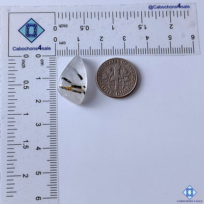 cabochons4sale, natural black rutile quartz fancy cabochons featuring dark rutile needles across a clear to white quartz base, intricate inclusions and smooth texture held between fingers