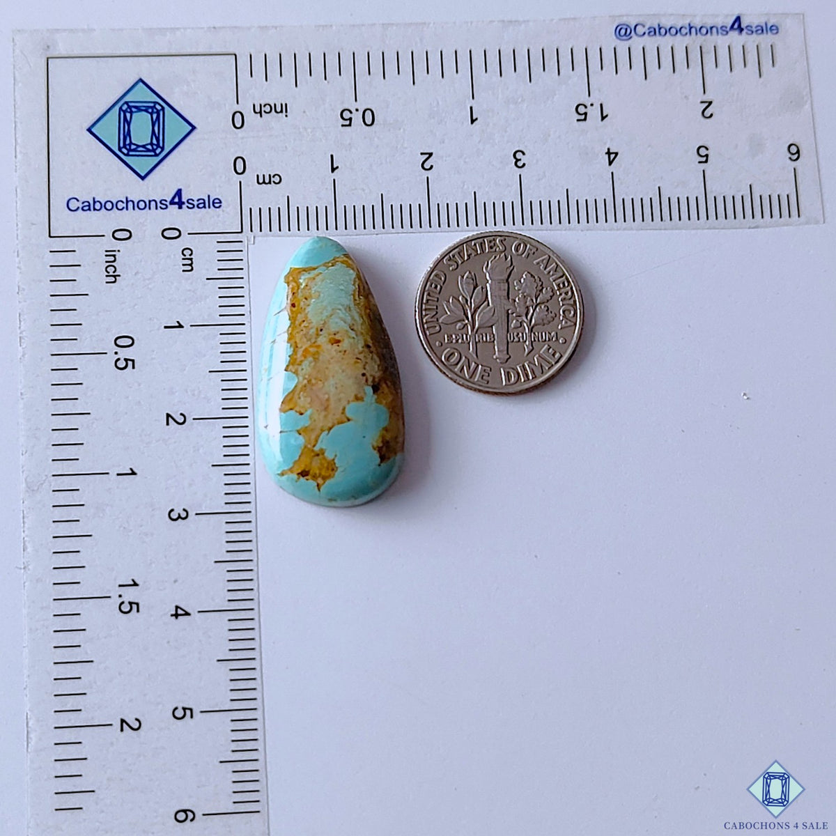 cabochons4sale, blue and yellow turquoise pear cabochons featuring distinctive natural matrix markings, warm mineral tones and a smooth polished finish held between fingers