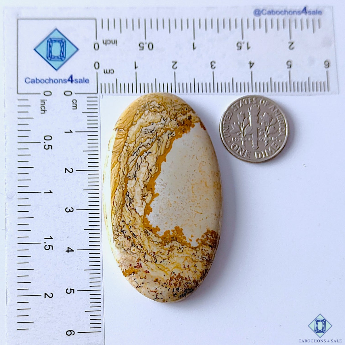cabochons4sale, natural brown and yellow picture jasper oval cabochons displaying artistic landscape-like markings, warm earth tones and unique mineral textures held between fingers