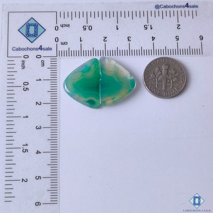 cabochons4sale, fancy green banded agate gemstone cabochons featuring delicate curved bands, rich green color variation and smooth stone texture held between fingers