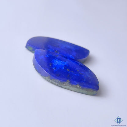 cabochons4sale, royal blue lapis lazuli fancy cabochon pairs showcasing natural stone markings, smooth polish and elegant gemstone appeal held between fingers