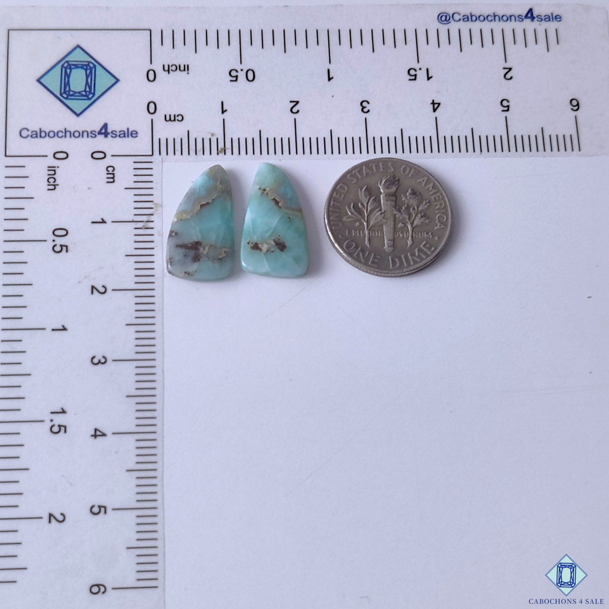 cabochons4sale, blue white larimar fancy gemstone cabochons featuring cloudy mineral formations, flowing patterns and smooth polished surfaces held between fingers