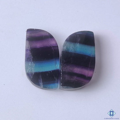 cabochons4sale, fancy multicolor fluorite cabochons with purple, green and blue zoning, natural mineral patterns and polished surfaces held between fingers