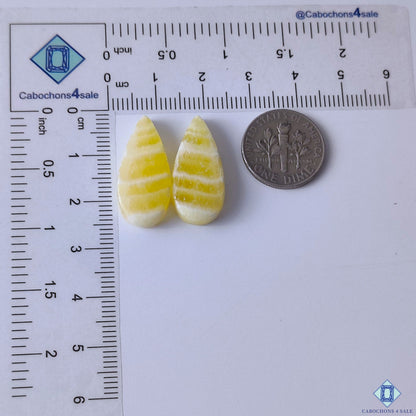 cabochons4sale, golden yellow calcite pear gemstone cabochons featuring gentle color variation, luminous texture and polished stone surfaces held between fingers