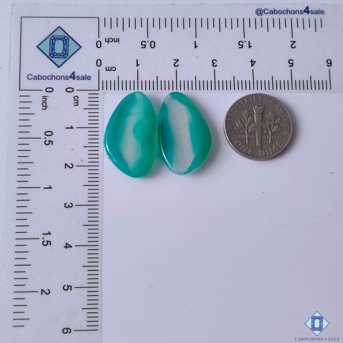 cabochons4sale, green banded agate fancy gemstone cabochons displaying flowing translucent layers, intricate banding and a refined polished surface held between fingers