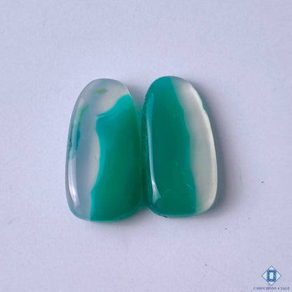 cabochons4sale, green and white green banded agate fancy cabochons with intricate flowing stripes, organic mineral layers and polished surfaces held between fingers