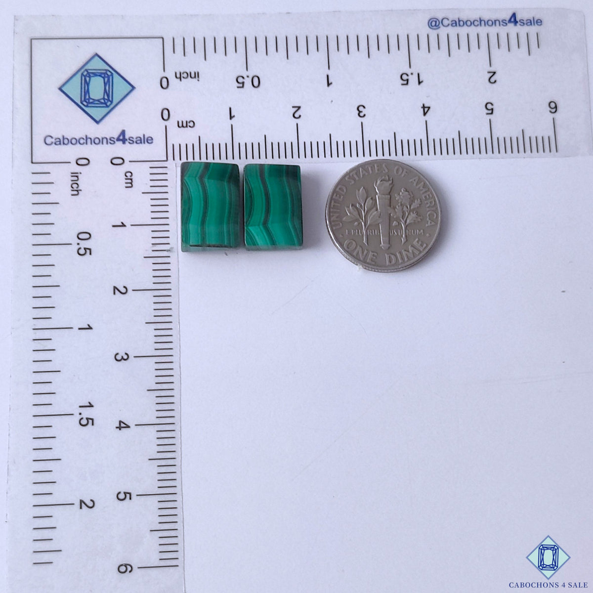 cabochons4sale, polished green malachite rectangular gemstone cabochons featuring flowing concentric patterns and deep emerald mineral tones held between fingers