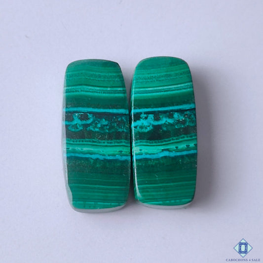 cabochons4sale, natural green malachite rectangular cabochons with bold layered bands, deep mineral tones and polished gemstone surfaces held between fingers