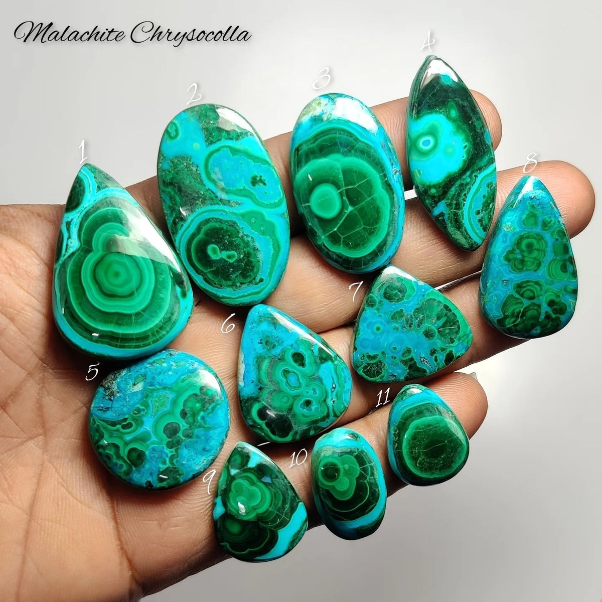 Cabochons4sale collection of polished malachite chrysocolla gemstones in various shapes held in a hand