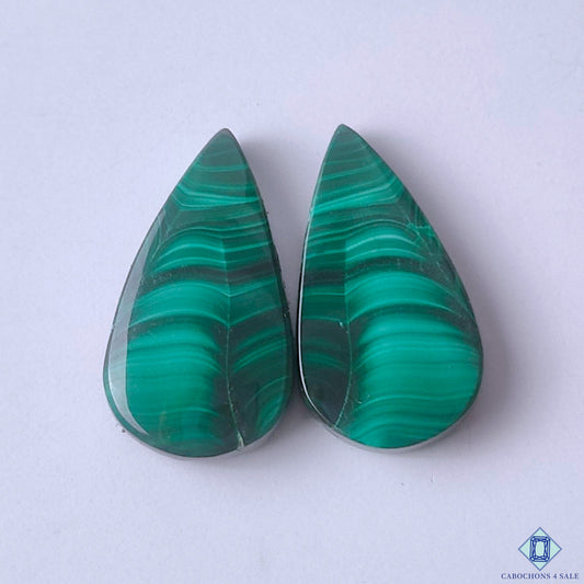 cabochons4sale, natural green malachite pear cabochons with flowing banded patterns, rich color and polished gemstone surfaces held between fingers