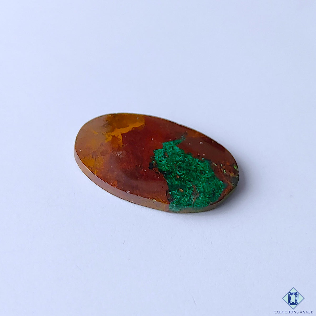cabochons4sale, polished multicolor malachite oval cabochons showcasing contrasting green hues, curved banding and intricate natural stone texture held between fingers