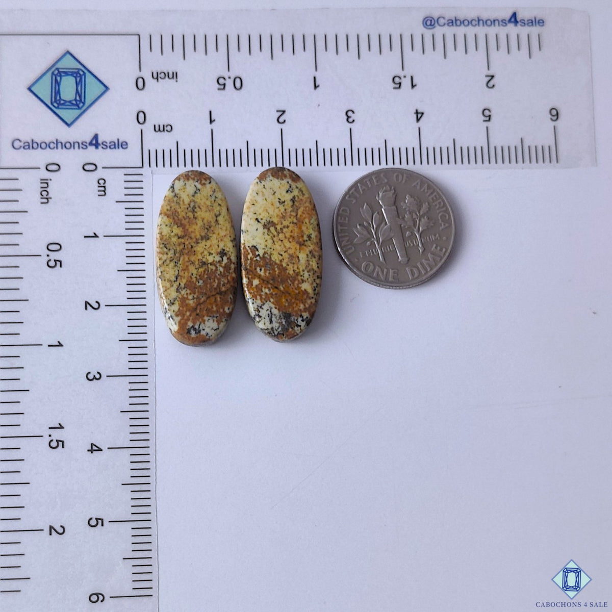 cabochons4sale, natural picture jasper oval gemstone cabochons in warm brown shades with scenic markings and polished surfaces held between fingers