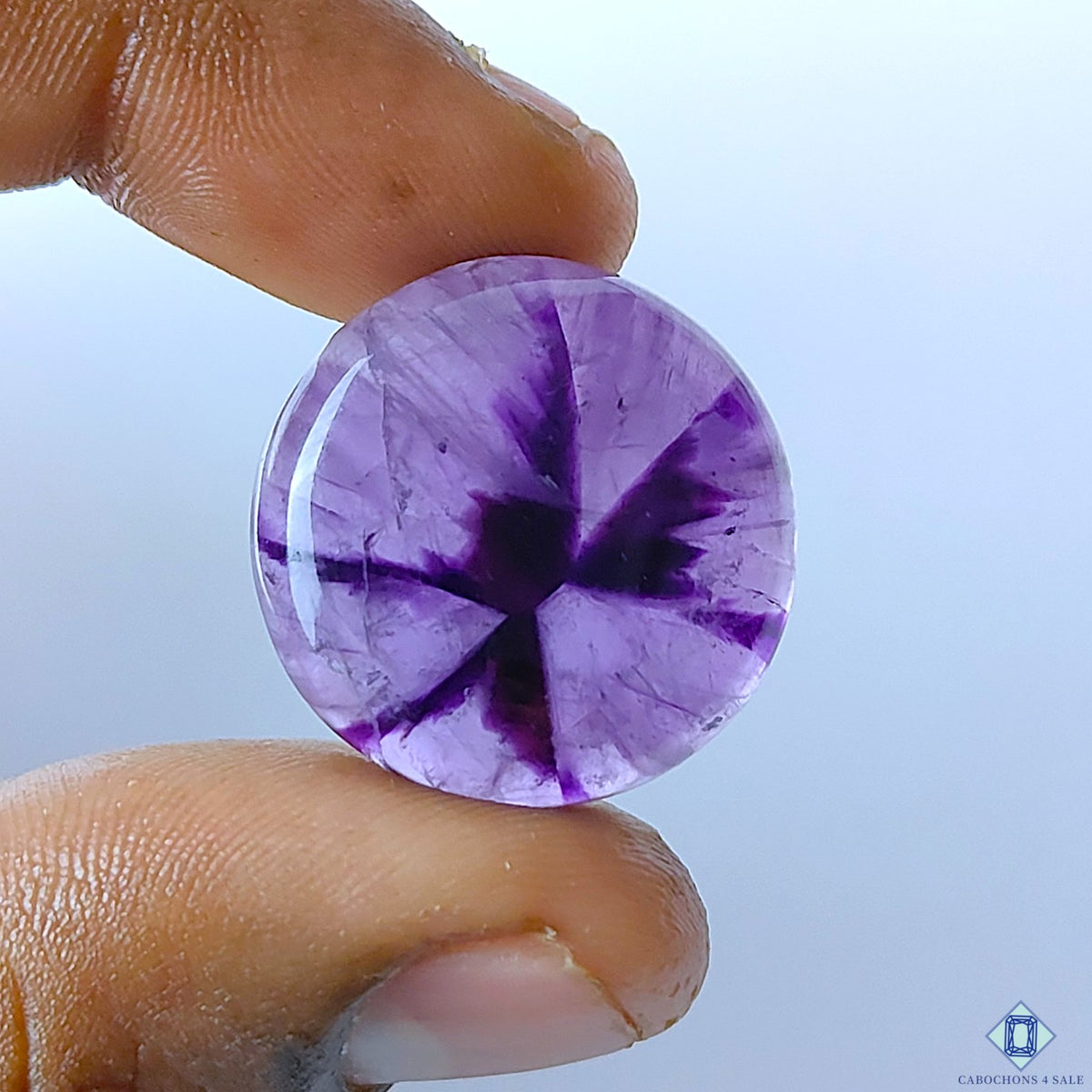 cabochons4sale, natural purple amethyst round cabochons with rich violet tones, subtle crystalline depth and smooth polished gemstone surfaces held between fingers