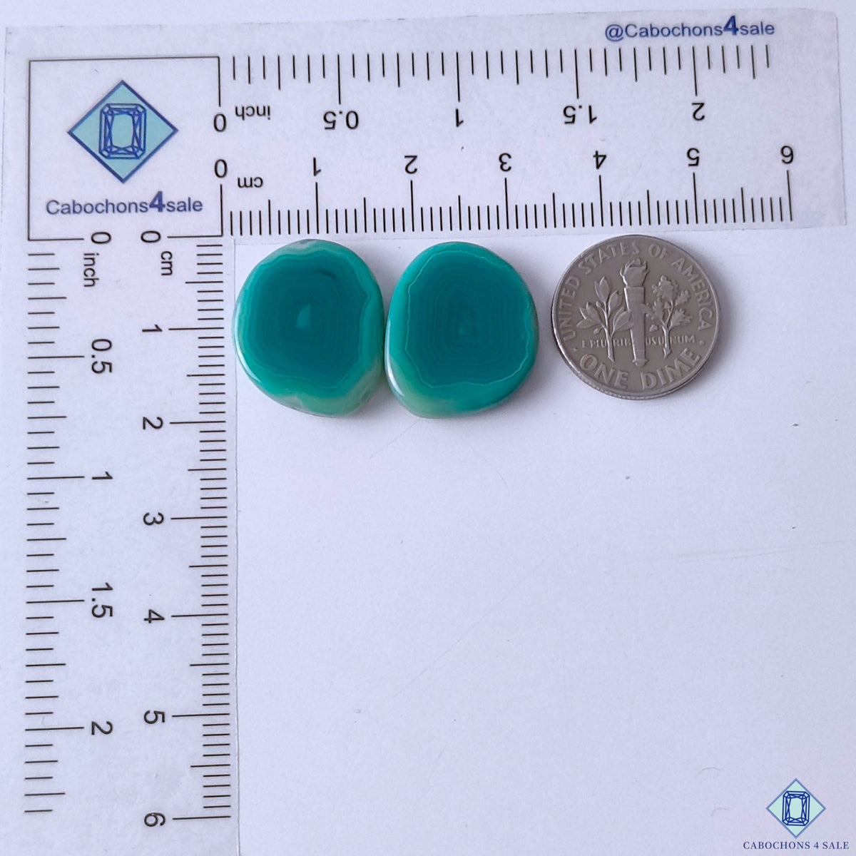 cabochons4sale, polished green banded agate oval gemstone cabochons featuring graceful curved stripes, translucent layers and unique natural stone texture held between fingers