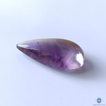 cabochons4sale, purple ametrine pear cabochons featuring natural quartz formations, soft color transitions, refined polish and unique crystalline texture held between fingers