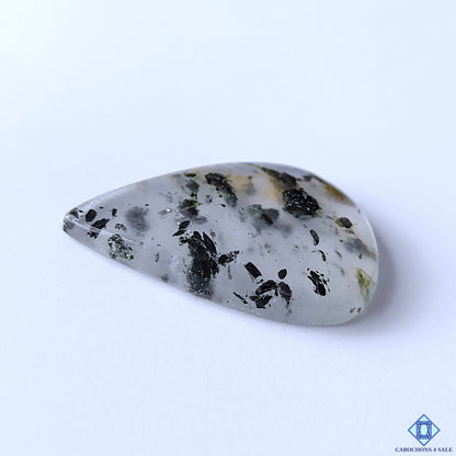 cabochons4sale, polished green tourmaline quartz pear cabochons showcasing vivid green inclusions, milky white quartz and unique organic gemstone formations held between fingers