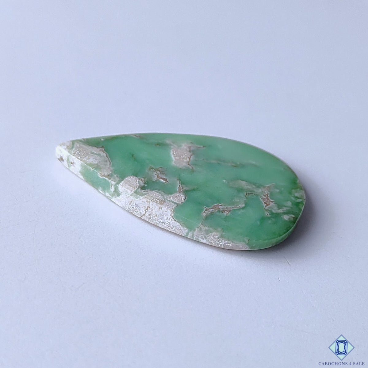 cabochons4sale, green variscite pear cabochons featuring distinctive natural matrix lines, gentle tonal depth and a refined polished stone finish held between fingers