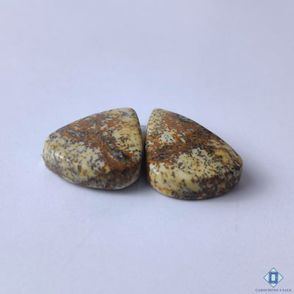 cabochons4sale, polished brown picture jasper pear cabochons showcasing unique natural patterns, rustic tones and distinctive gemstone texture held between fingers