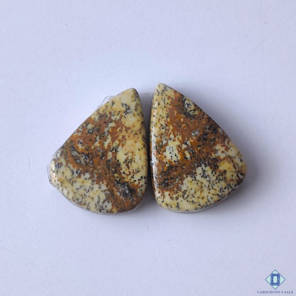 cabochons4sale, natural brown picture jasper pear cabochons with scenic mineral patterns and earthy gemstone character held between fingers