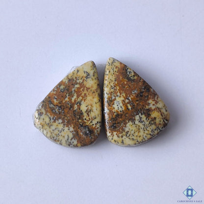 cabochons4sale, natural brown picture jasper pear cabochons with scenic mineral patterns and earthy gemstone character held between fingers