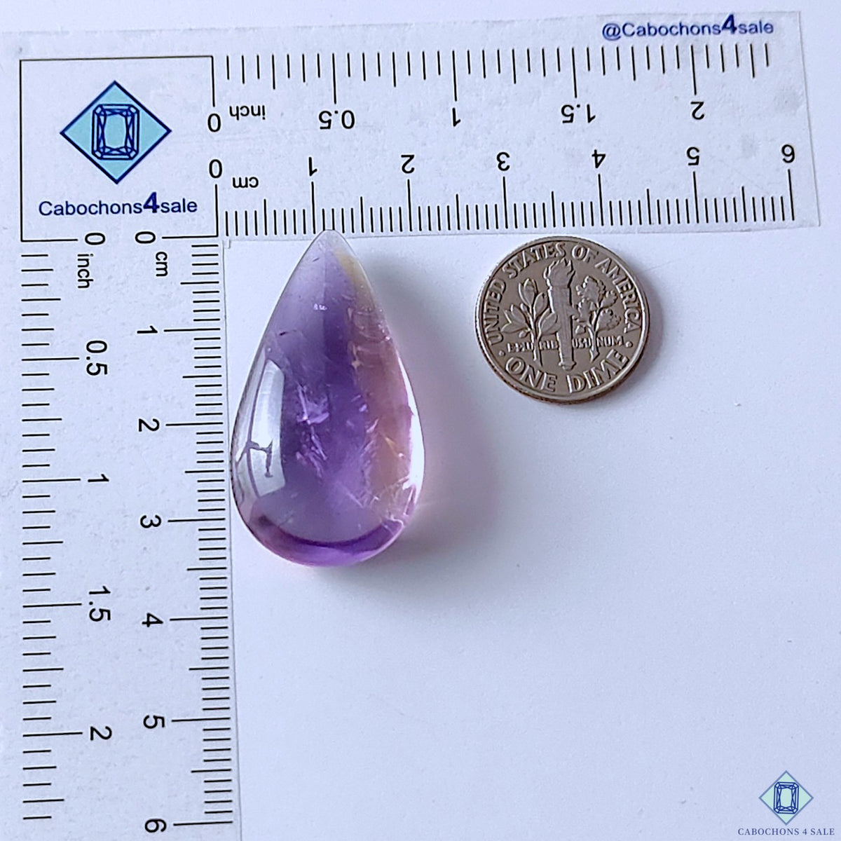 cabochons4sale, polished purple ametrine pear cabochons showcasing elegant violet coloration, natural internal zoning and distinctive quartz gemstone character held between fingers