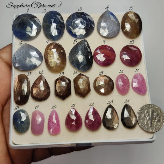Cabochons4sale collection of natural rose cut sapphire gemstones in various shapes and colours on a display tray.