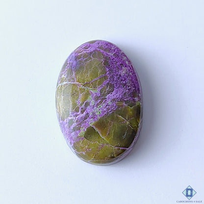 cabochons4sale, natural stichtite oval cabochons in purple and green shades with soft color blending, organic mineral patterns and polished surfaces held between fingers