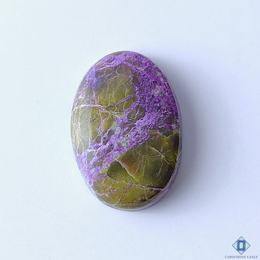 cabochons4sale, natural stichtite oval cabochons in purple and green shades with soft color blending, organic mineral patterns and polished surfaces held between fingers