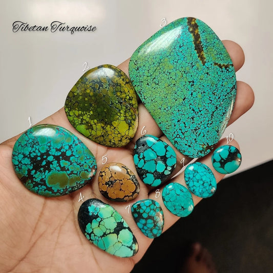 Cabochons4sale natural Tibetan turquoise cabochons in various blue and green shades with unique dark matrix patterns.
