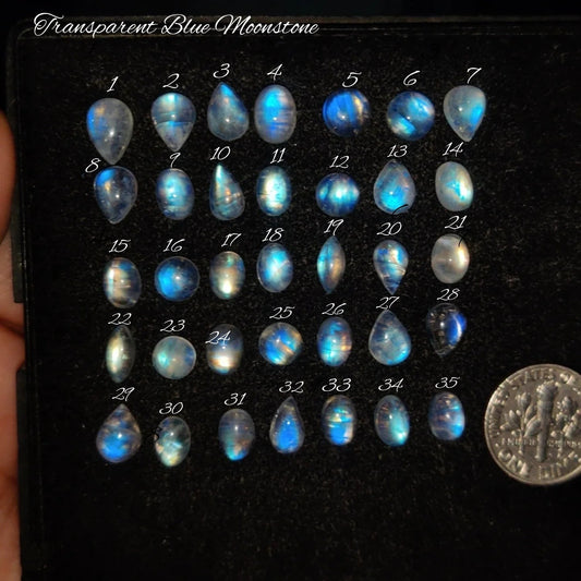 Cabochons4sale collection of numbered transparent blue moonstone cabochons with iridescent blue light play
