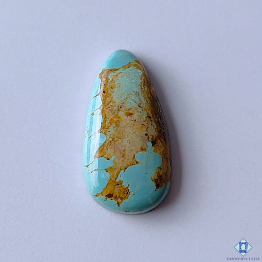 cabochons4sale, natural turquoise pear cabochons in blue and yellow shades with earthy matrix patterns, subtle color variation and polished gemstone surfaces held between fingers